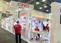 A group of people in front of a trade show display rentals in Las Vegas