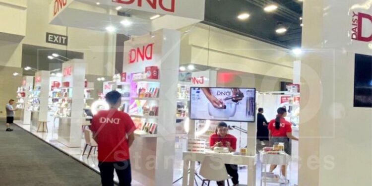 A group of people in front of a trade show display rentals in Las Vegas